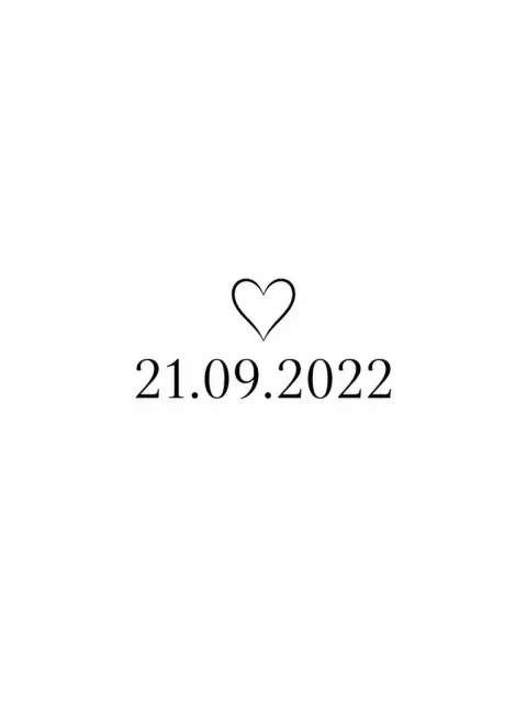 Exact date 21.09.2022 in clear black numerals with one small outline heart centered above, minimal keepsake.